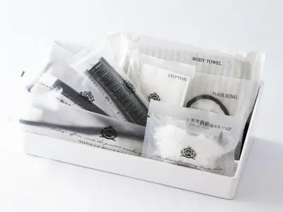 a white box filled with black and white toothbrushes at APA Hotel Tokyo Ojima in Tokyo