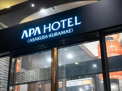 a hotel sign on the front of a building at APA Hotel Asakusa Kuramae in Tokyo