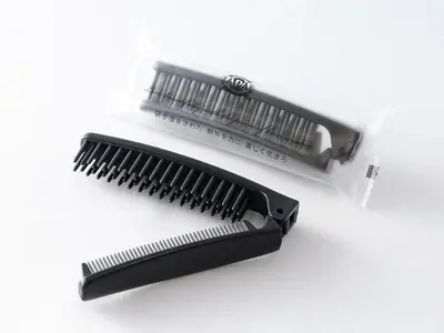 a black comb and a white plastic bag at APA Hotel Asakusa Kuramae in Tokyo