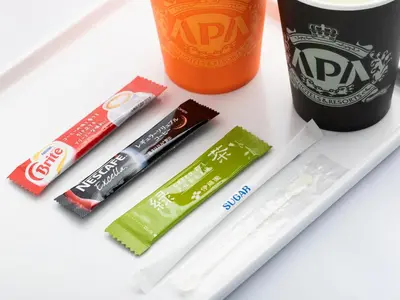 a group of toothbrushes and a bottle of soda at APA Hotel Ikebukuro Eki Kitaguchi in Tokyo