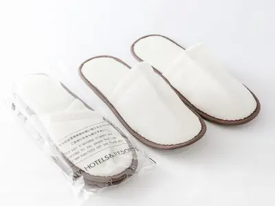 a pair of white shoes in a plastic bag at APA Hotel Tokyo Itabashi Ekimae in Tokyo