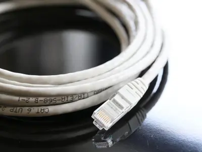 a close up of a camera strap on top of a camera at APA Hotel Nishiazabu in Tokyo
