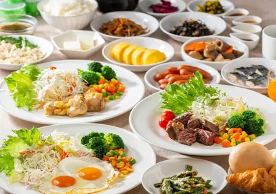 a bunch of plates of food on a table at APA Hotel Ningyocho Ekikita in Tokyo