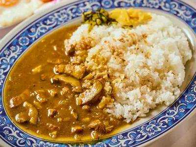 a blue and white plate of food with rice at APA Hotel Kodemmacho Ekimae in Tokyo