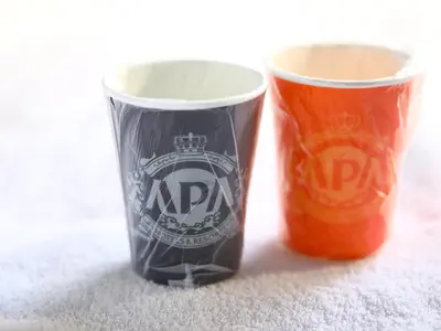 two cups sitting next to each other on the floor at APA Hotel Hatchobori Ekiminami in Tokyo