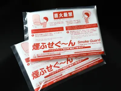 a package of smoke guard signs is shown at APA Hotel Hatchobori Ekiminami in Tokyo