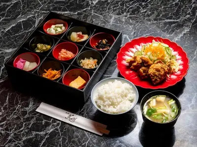 a table with a tray of food and a plate of rice at APA Hotel Tsukiji Ekiminami in Tokyo