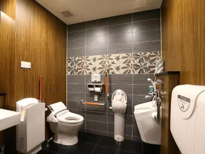 a bathroom with two toilets and a sink at APA Hotel Tsukiji Ekiminami in Tokyo