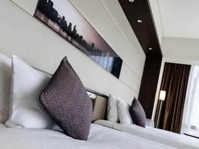 a hotel room with a bed with two pillows at Solaria Nishitetsu Hotel Ginza in Tokyo
