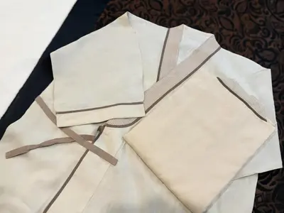 a pile of white papers on a table at Hotel Amethyst in Tokyo
