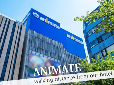 a building with a sign that reads ambulance walking distance from our hotel at Hotel Amethyst in Tokyo