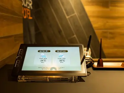 a tablet computer sitting on top of a table at Super Hotel Tokyo Shiba in Tokyo