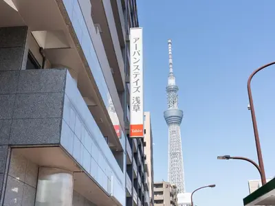 a view of the television tower from the street at Tabist Urban Stays Asakusa in Tokyo