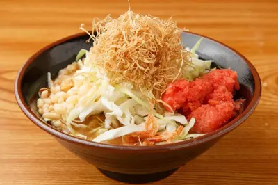 a bowl of food with noodles and other ingredients at Tabist Urban Stays Asakusa in Tokyo
