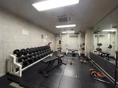 a gym with lots of equipment in a room at Capsule Inn Kinshicho in Tokyo