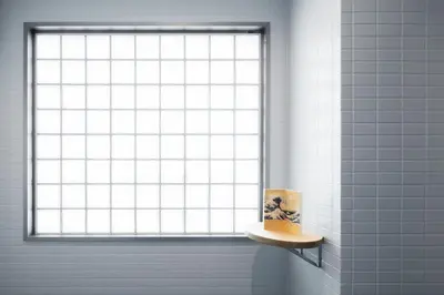 a window in a bathroom with a cake on a shelf at Playsis East Tokyo in Tokyo