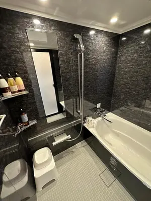 a bathroom with a tub and a toilet and a sink at HOTEL EXE (Adult Only) in Tokyo