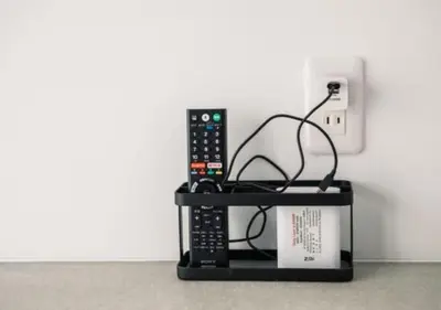 a remote control sitting on top of a shelf at SPATIUM GINZA in Tokyo