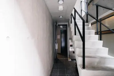 a hallway with stairs in a building at SPATIUM GINZA in Tokyo