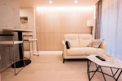 a living room with a white couch and a table at SPATIUM GINZA in Tokyo