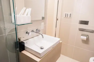 a bathroom with a sink and a shower at SPATIUM GINZA in Tokyo