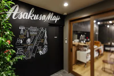 a chalkboard sign on the door of a restaurant at HOTEL AMANEK Asakusa Ekimae in Tokyo