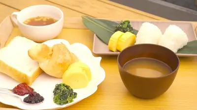 a table with a plate of food and a cup of tea at HOTEL AMANEK Asakusa Ekimae in Tokyo