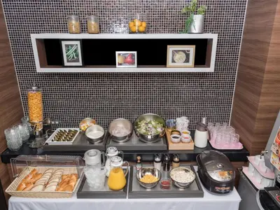 a kitchen with various food items on a table at Sotetsu Fresa Inn Hamamatsucho-Daimon in Tokyo