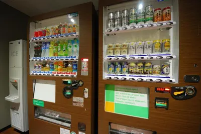 a vending machine filled with lots of bottles of soda at Sotetsu Fresa Inn Hamamatsucho-Daimon in Tokyo