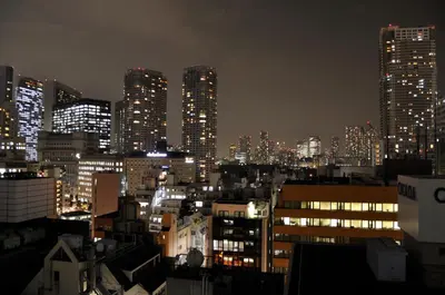 a city skyline at night with tall buildings at Sotetsu Fresa Inn Hamamatsucho-Daimon in Tokyo