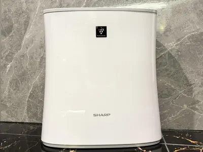 a white laptop sitting on top of a counter at Hotel Rocks in Tokyo