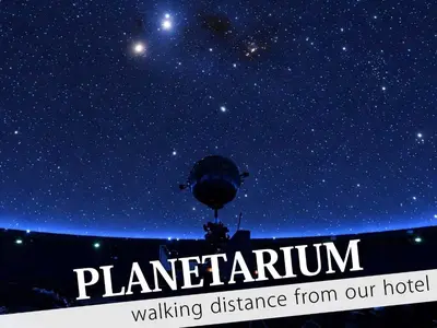 a starry night with the words planetarium walking distance from our hotel at Ikebukuro Central Hotel in Tokyo
