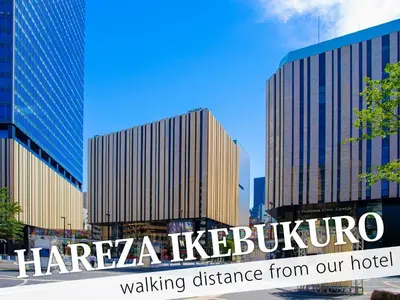 a view of the harza klezvisor sign in front of buildings at Ikebukuro Central Hotel in Tokyo