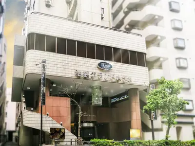 a building with a sign on the front of it at Ikebukuro Grand Hotel in Tokyo