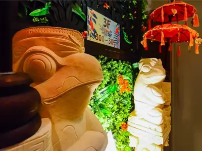 a statue in front of a display of flowers at Ikebukuro Grand Hotel in Tokyo