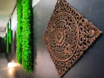 a metal plate on a wall with moss on it at Ikebukuro Grand Hotel in Tokyo