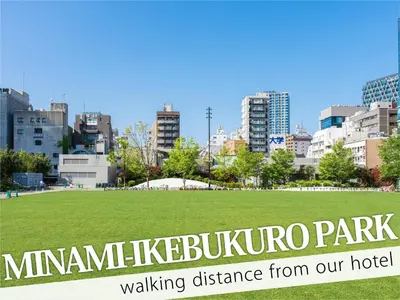 a park with a sign in front of a city at Ikebukuro Grand Hotel in Tokyo