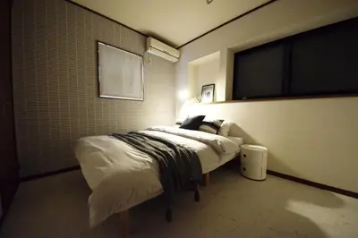 a bedroom with a bed in a room at The Nest Ikebukuro House in Tokyo