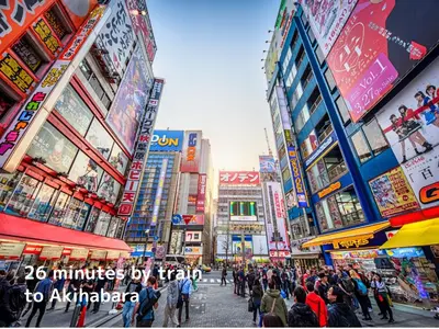 a crowd of people walking down a street in a city at KandoStay \u6d45\u8349EAST\u30c6\u30e9\u30b9 in Tokyo