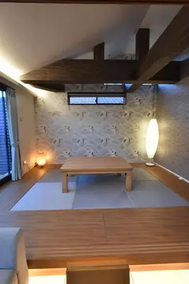 a living room with a wooden table and a couch at KandoStay \u6d45\u8349EAST\u30c6\u30e9\u30b9 in Tokyo