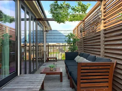 a patio with a couch and a coffee table at KandoStay \u6d45\u8349EAST\u30c6\u30e9\u30b9 in Tokyo
