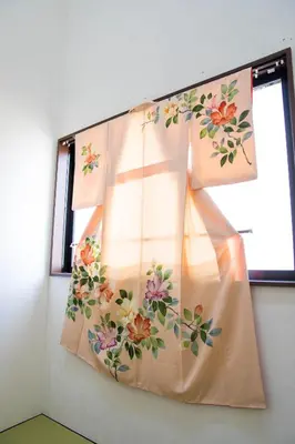 a window with a curtain with flowers on it at Tokyo Aoto House in Tokyo