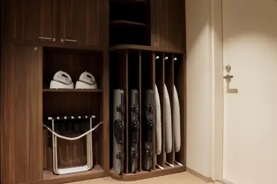 a cabinet filled with lots of baseball bats at Miyako City Tokyo Takanawa in Tokyo
