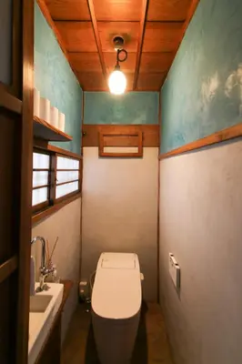 a small bathroom with a toilet and a sink at TOKYO LITTLE HOUSE in Tokyo