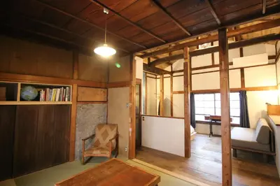 a living room with a table and a chair at TOKYO LITTLE HOUSE in Tokyo