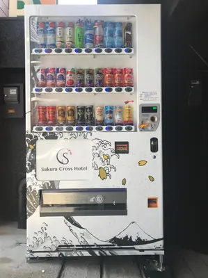 a refrigerator full of soda cans and drinks at Sakura Cross Hotel Shinjuku East in Tokyo
