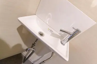 a white sink with a faucet in a bathroom at Sakura Cross Hotel Shinjuku East in Tokyo