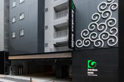 a building with a sign on the side of it at karaksa hotel TOKYO STATION in Tokyo