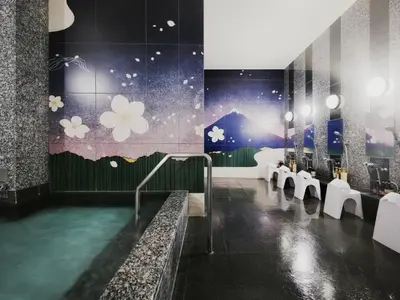 a bathroom with a bath tub with toilets and flowers on the wall at hotel MONday Premium TOYOSU in Tokyo