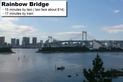 a view of a river with a bridge in the background at hotel MONday Premium TOYOSU in Tokyo